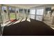 Bright sunroom with multiple windows offering natural light and backyard views at 2115 Leonard Rd, Martinsville, IN 46151