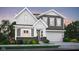 Charming two-story home featuring a welcoming front porch, a two-car garage, and landscaped yard at 2766 Linwood Ave, Greenwood, IN 46143