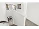 Bright hallway features stairs to living room and views of the modern decor and natural light streaming through the windows at 2766 Linwood Ave, Greenwood, IN 46143