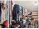 Attic closet filled with clothes and luggage, providing accessible storage for personal belongings at 307 Baywood Ct # 67, Noblesville, IN 46062