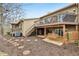 A backyard with mature trees, stepping stones, and a porch swing for relaxation and enjoying the peaceful outdoors at 307 Baywood Ct # 67, Noblesville, IN 46062