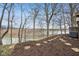 Beautiful backyard featuring mulched ground, trees, and partial lake view, ideal for relaxation and outdoor enjoyment at 307 Baywood Ct # 67, Noblesville, IN 46062