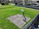 Aerial view of a community basketball court in a green space next to houses and a wooden fence at 307 Baywood Ct # 67, Noblesville, IN 46062