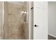 Bathroom with a sleek, glass-enclosed shower, and tile walls at 307 Baywood Ct # 67, Noblesville, IN 46062