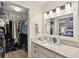 Bathroom vanity with granite countertops and a view into closet at 307 Baywood Ct # 67, Noblesville, IN 46062