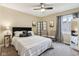 Neutral bedroom featuring a ceiling fan, decorative pillows, and a cozy, carpeted floor at 307 Baywood Ct # 67, Noblesville, IN 46062