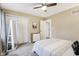Bedroom featuring a ceiling fan, white closets, and carpeted floor at 307 Baywood Ct # 67, Noblesville, IN 46062