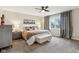 Bedroom featuring a ceiling fan, lamps, and a cozy, carpeted floor at 307 Baywood Ct # 67, Noblesville, IN 46062