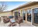 Outdoor deck with wicker furniture perfect for relaxing and entertaining guests while enjoying the surrounding scenery at 307 Baywood Ct # 67, Noblesville, IN 46062