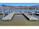 Lake view with multiple boat docks, offering waterfront access for boating and recreational activities at 307 Baywood Ct # 67, Noblesville, IN 46062