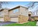 Inviting exterior view of a multi-level home with stone accents and a convenient attached garage at 307 Baywood Ct # 67, Noblesville, IN 46062