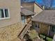 Elevated exterior perspective showcasing the home's entrance, siding, and unique stone foundation at 307 Baywood Ct # 67, Noblesville, IN 46062