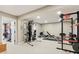 Spacious home gym with weight machines, bench, and ample room for workout equipment at 307 Baywood Ct # 67, Noblesville, IN 46062