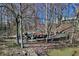 Outdoor kayak storage area showcases vibrant kayaks amidst a serene wooded backdrop in the community at 307 Baywood Ct # 67, Noblesville, IN 46062