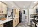 Well-lit kitchen featuring light wood cabinets, white countertops, black appliances, and slate tile flooring at 307 Baywood Ct # 67, Noblesville, IN 46062