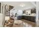 Open-concept view of a living space with a spiral staircase and kitchen area, creating a welcoming atmosphere at 307 Baywood Ct # 67, Noblesville, IN 46062