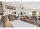 Spacious living room with high ceilings, comfortable leather sofas, and an open layout for entertaining guests at 307 Baywood Ct # 67, Noblesville, IN 46062