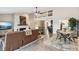 Open-concept living space featuring a stone fireplace, a cozy sofa, and a dining area with ample natural light at 307 Baywood Ct # 67, Noblesville, IN 46062