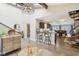 Open-concept living space flowing into the kitchen, featuring high ceilings and wood flooring at 307 Baywood Ct # 67, Noblesville, IN 46062