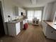 A kitchen with white cabinets, granite countertops, and a window offering ample natural light at 3179 W 400 N, Fairland, IN 46126