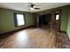 Cozy living room with hardwood floors, a window, and ceiling fan at 3179 W 400 N, Fairland, IN 46126