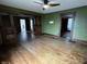 Spacious living room featuring a ceiling fan and beautiful hardwood floors at 3179 W 400 N, Fairland, IN 46126