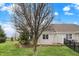 Spacious backyard with lush green grass, mature tree, and metal fence at 3447 Heathcliff Ct, Westfield, IN 46074