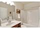 Bathroom featuring a single vanity, a large mirror and a tub with shower at 3447 Heathcliff Ct, Westfield, IN 46074