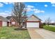 Charming brick home featuring a two-car garage, well-manicured lawn, and an inviting entryway at 3447 Heathcliff Ct, Westfield, IN 46074