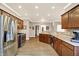Spacious kitchen with stainless steel appliances, ample counter space, and hardwood floors at 3447 Heathcliff Ct, Westfield, IN 46074