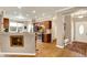 Open-concept kitchen with wood floors, modern appliances, and adjacent entryway at 3447 Heathcliff Ct, Westfield, IN 46074
