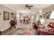 Open-concept living room showcases hardwood floors, neutral walls, and modern furnishings, blending comfort and style at 3447 Heathcliff Ct, Westfield, IN 46074