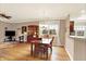 Open concept living and dining room with hardwood floors, neutral paint, large window and plenty of natural light at 3447 Heathcliff Ct, Westfield, IN 46074