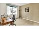Bright office space featuring a large window, desk, and comfortable office chair at 3447 Heathcliff Ct, Westfield, IN 46074