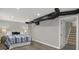Spacious basement area with open ceiling, recessed lighting and walk up stairs at 3601 Carrollton Ave, Indianapolis, IN 46205