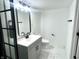 Bathroom featuring a sleek vanity with modern fixtures, a toilet, and tile floors at 3601 Carrollton Ave, Indianapolis, IN 46205