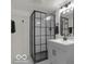 Modern bathroom with a glass-enclosed shower and sleek vanity at 3601 Carrollton Ave, Indianapolis, IN 46205