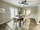 Bright dining room with modern table, chairs, and backyard access at 3601 Carrollton Ave, Indianapolis, IN 46205