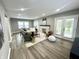 Well-lit living room featuring recessed lighting, cozy furniture, and modern fireplace at 3601 Carrollton Ave, Indianapolis, IN 46205
