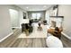 Spacious open-concept living area with comfortable seating, modern decor, and hardwood floors at 3601 Carrollton Ave, Indianapolis, IN 46205