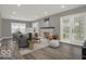 Well-lit living room featuring recessed lighting, cozy furniture, and modern fireplace at 3601 Carrollton Ave, Indianapolis, IN 46205