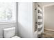 Bathroom with toilet, tile flooring, and shower with shower curtain, providing a functional space at 3641 Shady Lake Dr, Westfield, IN 46074