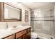 Bathroom featuring a glass shower, cherry vanity, and framed mirror at 3641 Shady Lake Dr, Westfield, IN 46074