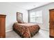 Comfortable bedroom with a patterned bed, framed wall art, and natural light at 3641 Shady Lake Dr, Westfield, IN 46074