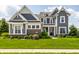 Inviting two-story home with lush green lawn and beautiful landscaping at 3641 Shady Lake Dr, Westfield, IN 46074
