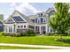 Inviting two-story home with lush green lawn and beautiful landscaping at 3641 Shady Lake Dr, Westfield, IN 46074