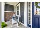 Cozy front porch featuring rocking chairs, brick accents, and a welcoming atmosphere at 3641 Shady Lake Dr, Westfield, IN 46074