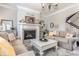 Comfortable living room with fireplace, neutral tones, and ample seating at 3641 Shady Lake Dr, Westfield, IN 46074