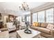 Open-concept living room seamlessly flows into the kitchen and dining area at 3641 Shady Lake Dr, Westfield, IN 46074