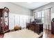 Home office with wainscotting, hardwood floors, and a spacious wooden desk at 3641 Shady Lake Dr, Westfield, IN 46074